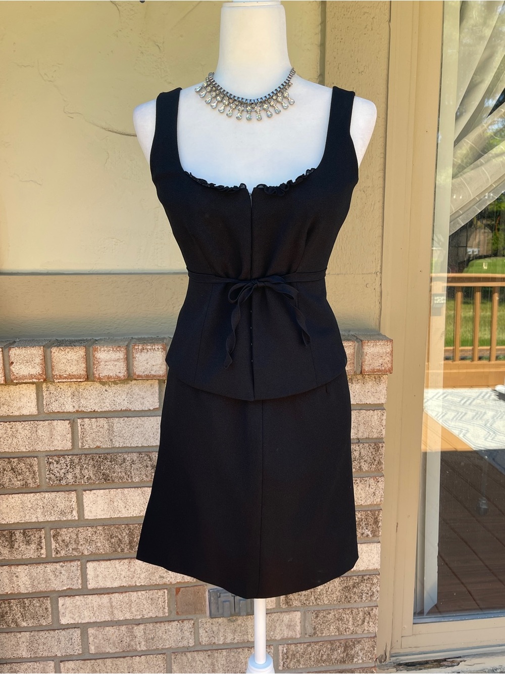 Moda International Black Sleeveless Peplum Dress